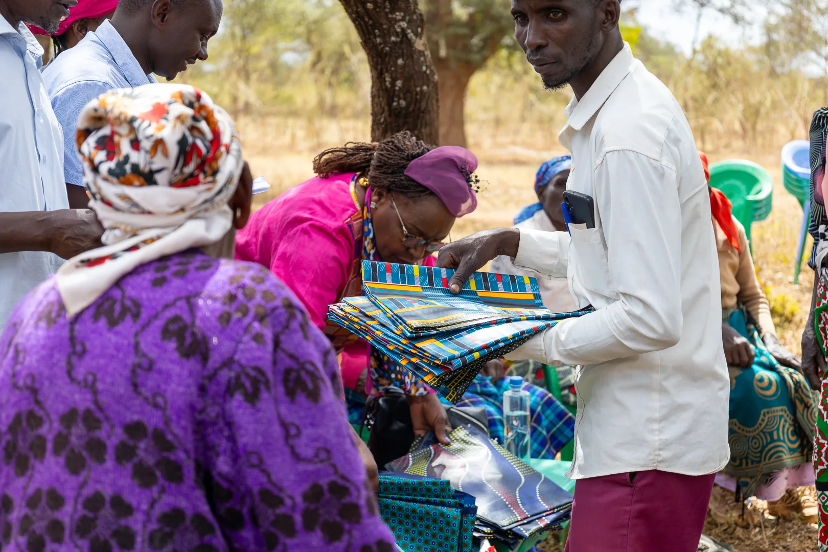 Community members distributing supplies during an outreach visit