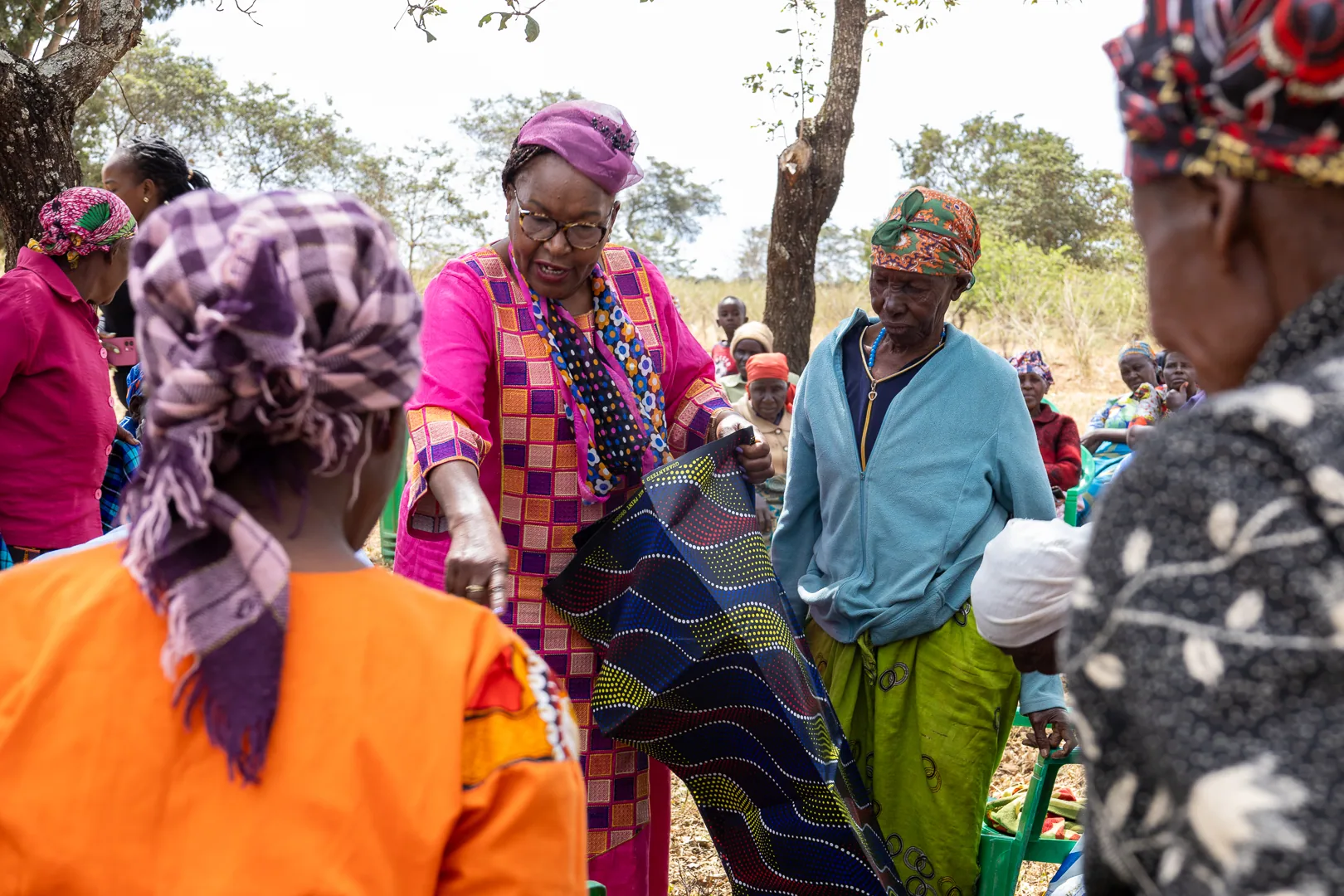 Hon. Nancy Kavinya Kioko sharing supplies with a community member